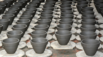 Unfired pots on the factory floor